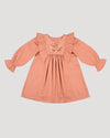 Early Sunday, Margot Dress in Earthy Pink, made from Cotton Satin fabric, featuring classic silhouette with floral embroidery around the yoke and ruffle detailing, shown in a front flat-lay view