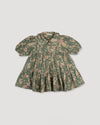 Early Sunday, Marguerite Dress in Autumn Bloom Soft Green, made from Printed Cotton Double Gauze fabric, featuring classic silhouette with a collar and ruffle detailing, shown in a back flat-lay view