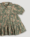 Early Sunday, Marguerite Dress in Autumn Bloom Soft Green, made from Printed Cotton Double Gauze fabric, featuring classic silhouette with a collar and ruffle detailing, shown in a closeup flat-lay view