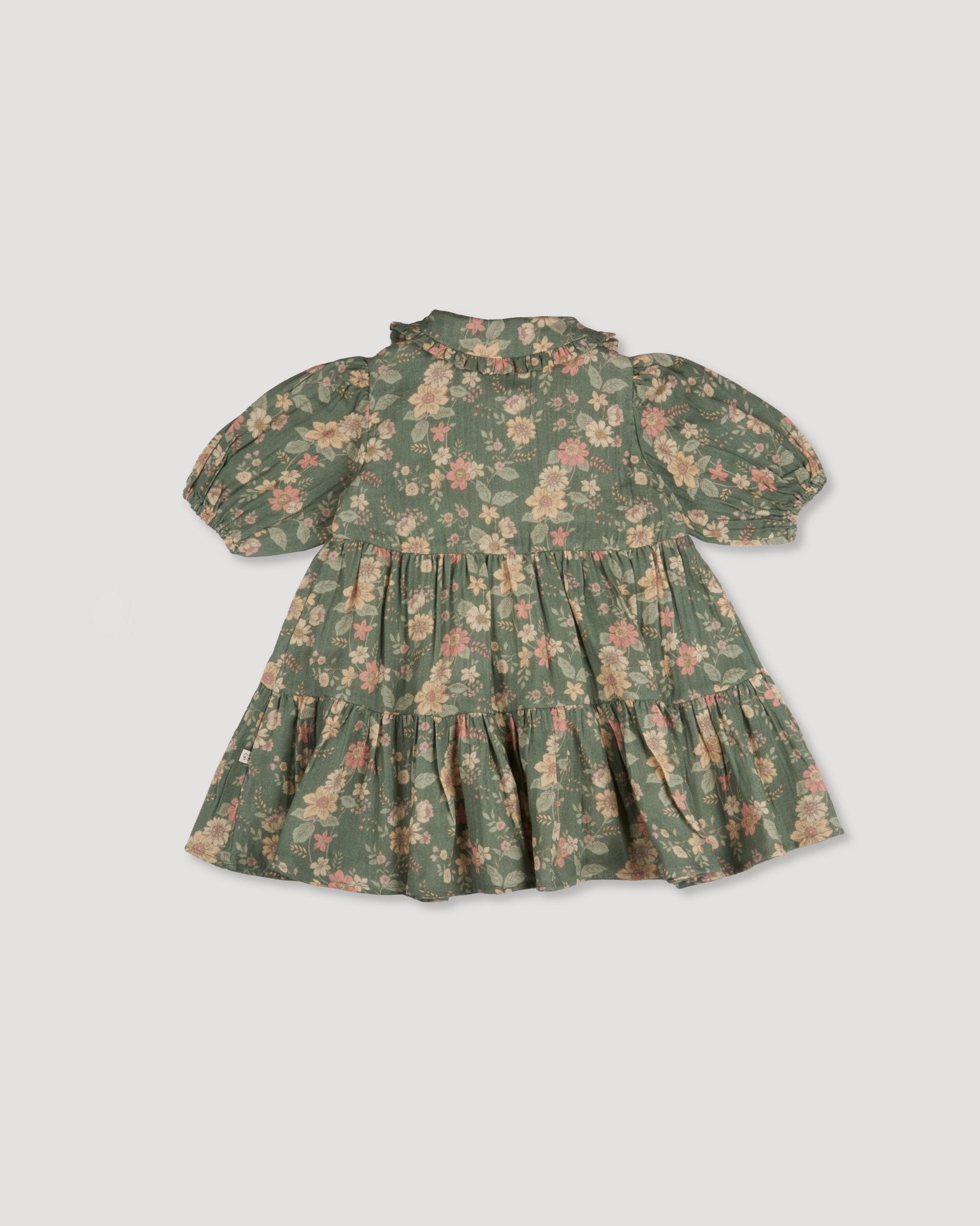 Early Sunday, Marguerite Dress in Autumn Bloom Soft Green, made from Printed Cotton Double Gauze fabric, featuring classic silhouette with a collar and ruffle detailing, shown in a front flat-lay view