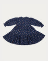 Early Sunday, Marguerite Dress in Ditsy Bouquet Navy, made from Printed Cotton Satin fabric, featuring gathered sleeves with frilled Peter Pan collar, shown in a back flat-lay view