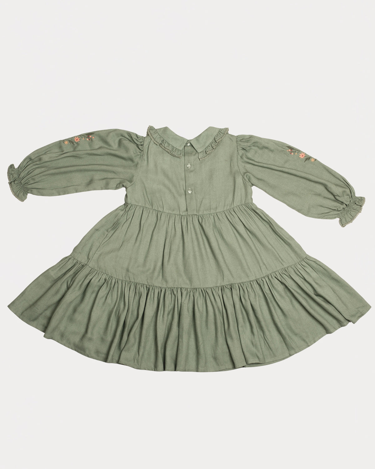 Early Sunday, Marguerite Dress in Sage Green, made from Viscose Drapey Twill fabric, featuring floral embroidery with frilled Peter Pan collar and gathered sleeves, shown in a back flat-lay view
