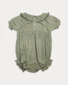 Early Sunday, Mathilda Baby Bubble Romper in Sage Green, made from Viscose Twill fabric, featuring a floral embroidery on a frilly peter pan collar, shown in a back flat-lay view