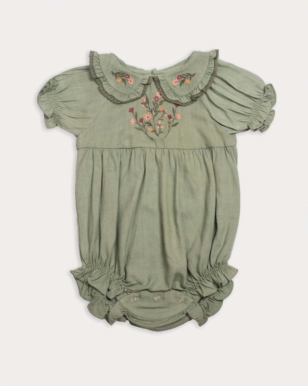 Early Sunday, Mathilda Baby Bubble Romper in Sage Green, made from Viscose Twill fabric, featuring a floral embroidery on a frilly peter pan collar, shown in a front flat-lay view