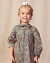 Early Sunday, Melanie Dress in Autumn Garden Greyish Blue, made from Printed Cotton Satin fabric, featuring classic silhouette with a collar, shown in a front view of model wearing it