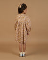 Early Sunday, Melanie Dress in Garden Flowers Dusty Pink, made from Printed Cotton Satin fabric, featuring classic silhouette with a collar, shown in a back view of model wearing it