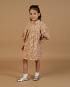 Early Sunday, Melanie Dress in Garden Flowers Dusty Pink, made from Printed Cotton Satin fabric, featuring classic silhouette with a collar, shown in a front view of model wearing it