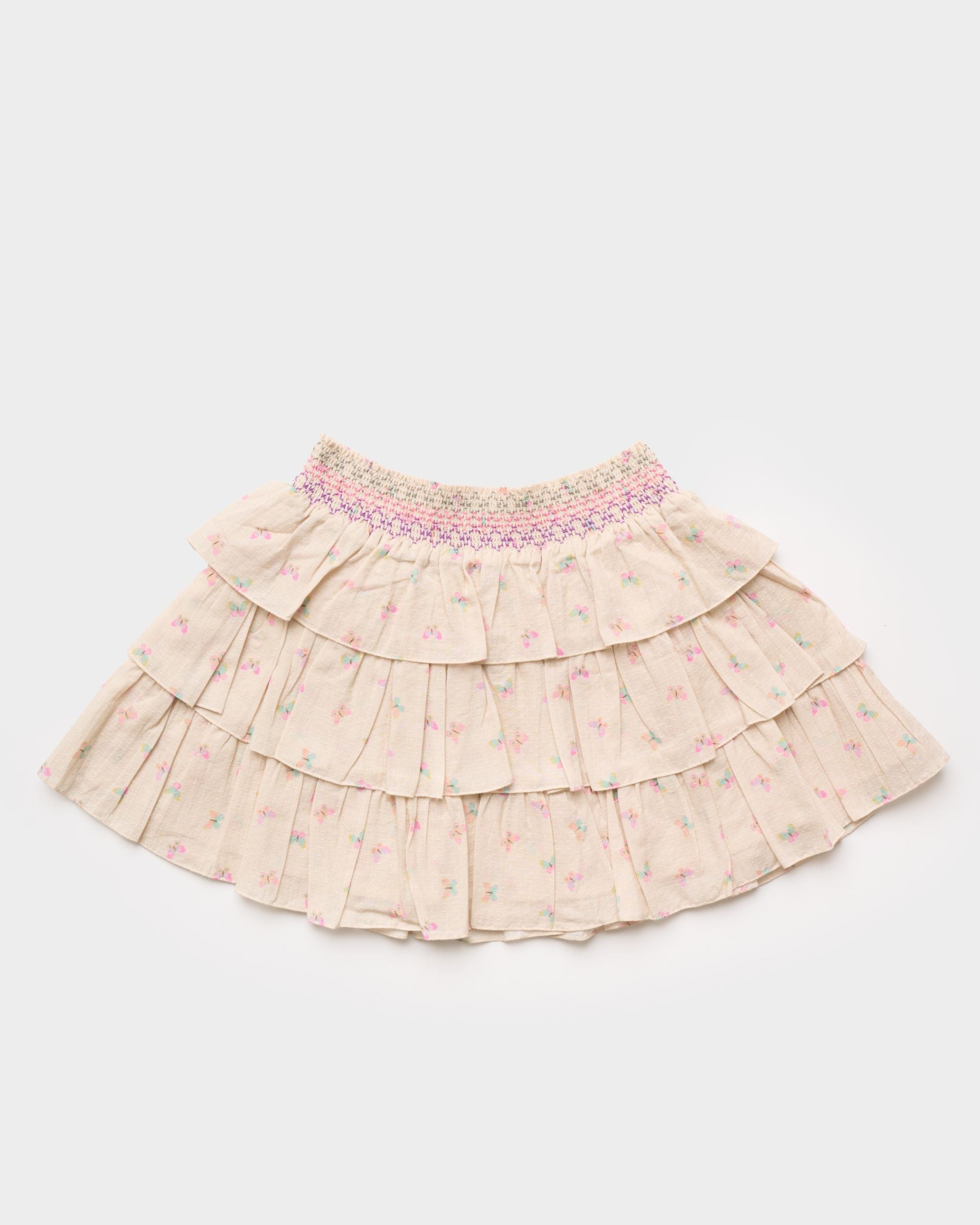 Early Sunday, Melissa Skirt in Butterflies print, made from Printed Cotton Tiny Swiss Dobby fabric, featuring tiered frilly skirt with smocked waistband, shown in a back flat-lay view