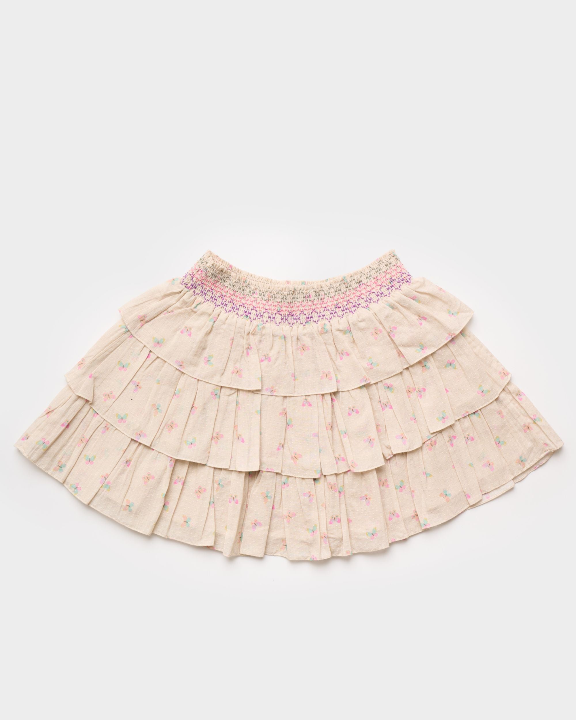 Early Sunday, Melissa Skirt in Butterflies print, made from Printed Cotton Tiny Swiss Dobby fabric, featuring tiered frilly skirt with smocked waistband, shown in a front flat-lay view