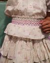 Early Sunday, Melissa Skirt in Butterflies print, made from Printed Cotton Tiny Swiss Dobby fabric, featuring tiered frilly skirt with smocked waistband, shown in a close up shot of model wearing outdoors