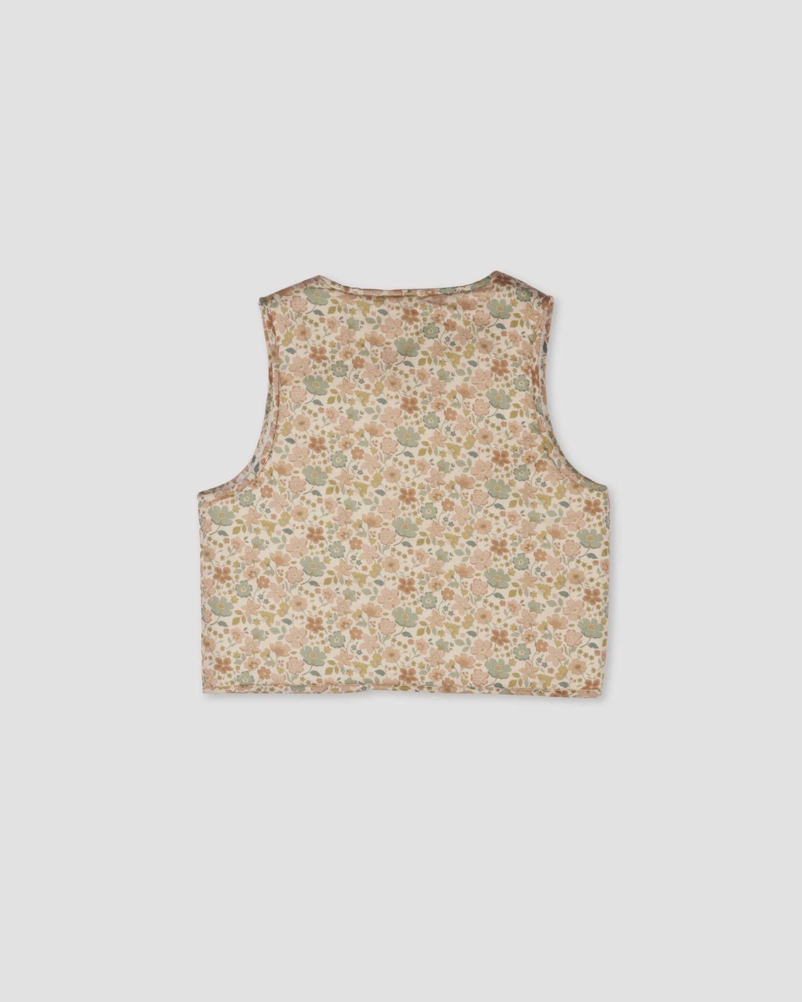 Early Sunday, Milly Baby Quilted Gilet (Reversible) in Garden Flowers print, made from Printed Cotton Cambric fabric, featuring reversible design for versatile styling, shown in a back flat-lay view