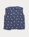 Early Sunday, Milly Baby Quilted Gilet in Ditsy Bouquet Navy, made from Printed Cotton Satin fabric, featuring a sleeveless jacket with a bow tie, shown in a back flat-lay view