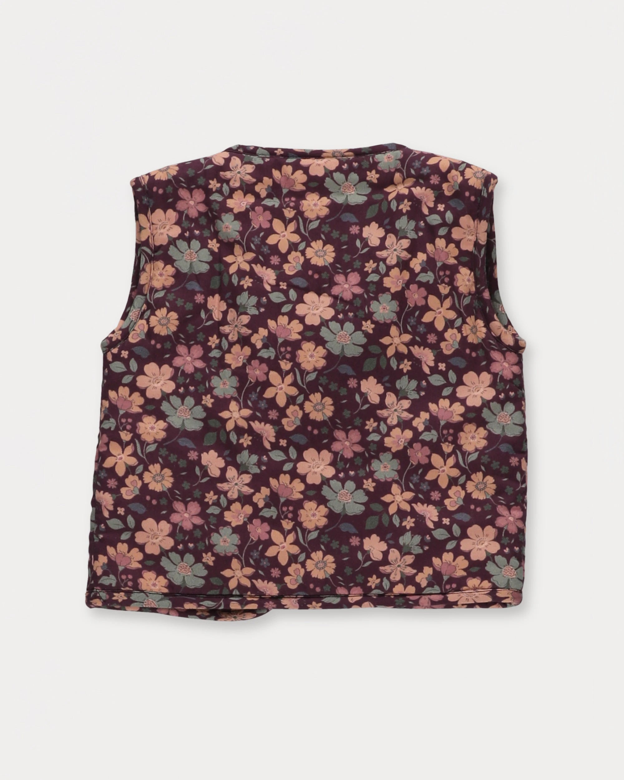 Early Sunday, Milly Baby Quilted Gilet in Garden Flowers Plum, made from Printed Cotton Satin fabric, featuring a sleeveless jacket with a bow tie, shown in a back flat-lay view
