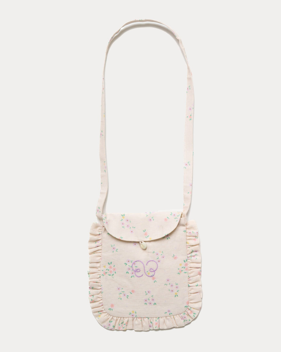 Early Sunday, Miss Sunday Sling in Painted Bouquet print, made from 70% Cotton, 30% Linen fabric, featuring a frill detailed sling purse with flap closure, shown in a front flat-lay view