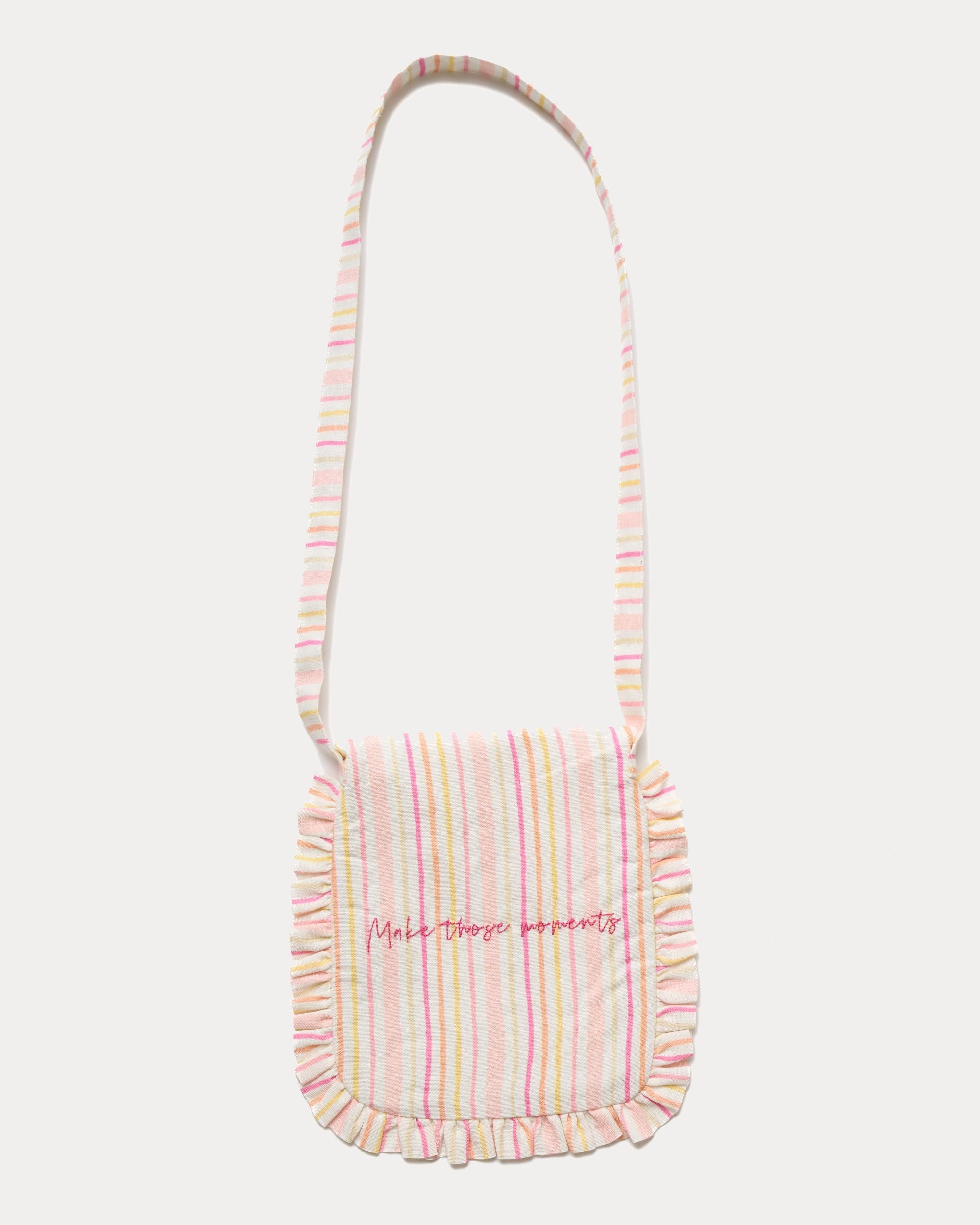 Early Sunday, Miss Sunday Sling in Pink Stripes print, made from 70% Cotton, 30% Linen fabric, featuring a frill detailed sling purse with flap closure, shown in a back flat-lay view