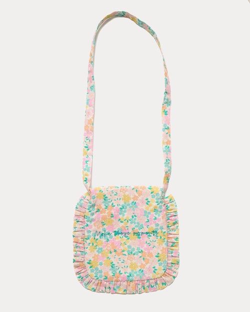 Early Sunday, Miss Sunday Sling in Emma Floral Mint color, made from Organic Printed Cotton Cambric fabric, featuring a frill detailed sling purse with flap closure, shown in back flat-lay view