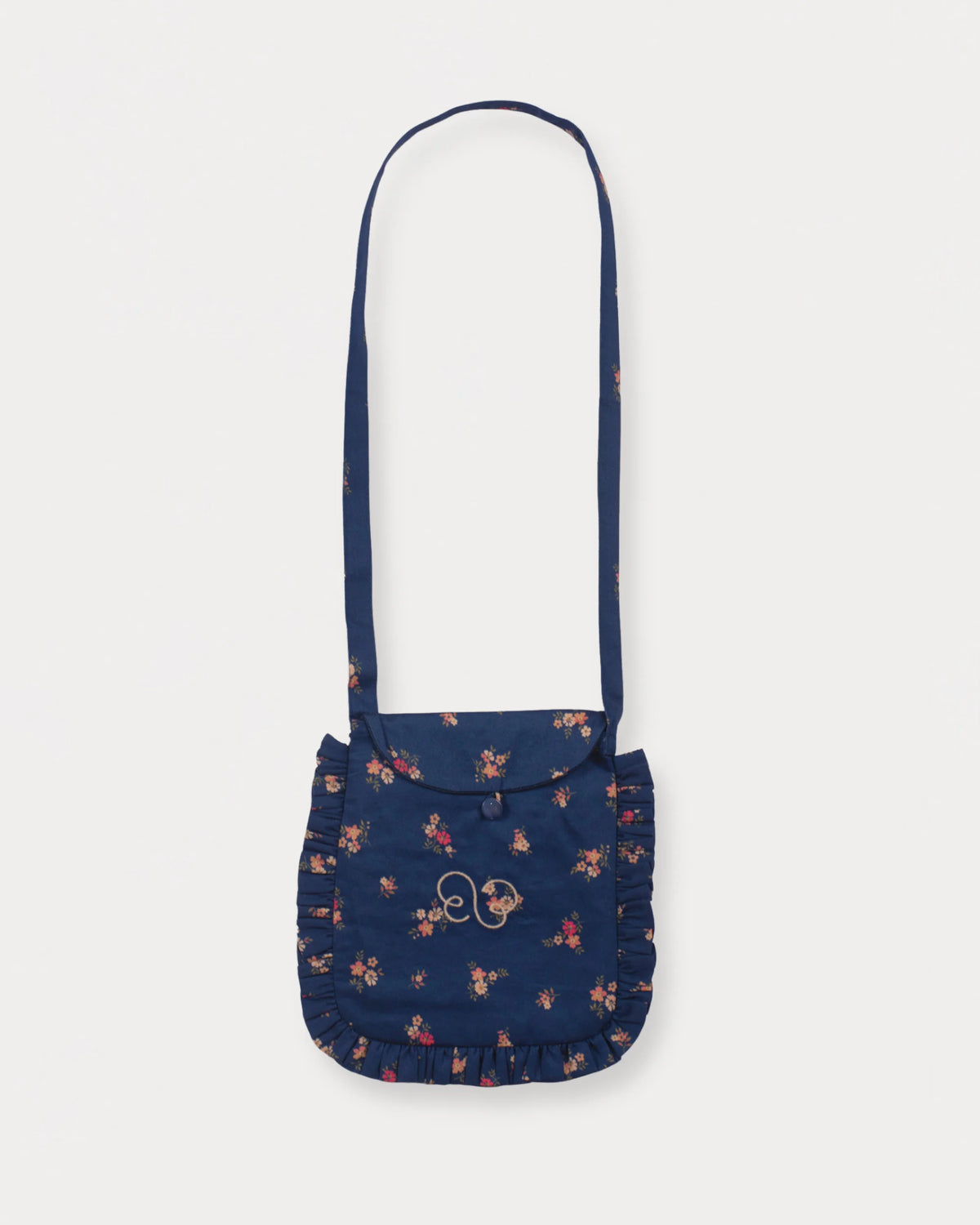 Early Sunday, Miss Sunday Sling in Ditsy Bouquet Navy Blue, made from Printed Cotton Satin fabric, featuring a frill detailed sling purse with flap closure, shown in a front flat-lay view