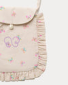 Early Sunday, Miss Sunday Sling in Butterflies print, made from Printed Cotton Tiny Swiss Dobby fabric, featuring a frill detailed sling purse with flap closure, shown in a closeup flat-lay view