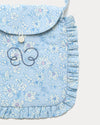 Early Sunday, Miss Sunday Sling in Tonal Floral Blue color, made from Printed Cotton Tiny Swiss Dobby fabric, featuring a frill detailed sling purse with flap closure, shown in closeup flat-lay view