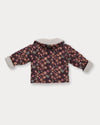 Early Sunday, Molly Baby Quilted Jacket in Garden Flowers Plum, made from Printed Cotton Satin fabric, featuring a sherpa collar & cuffed sleeves, shown in a back flat-lay view