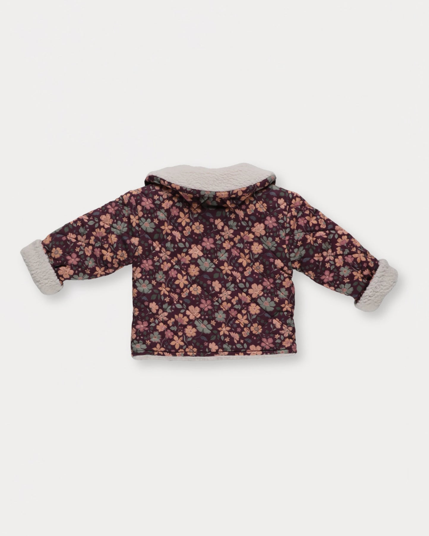 Early Sunday, Molly Baby Quilted Jacket in Garden Flowers Plum, made from Printed Cotton Satin fabric, featuring a sherpa collar & cuffed sleeves, shown in a back flat-lay view
