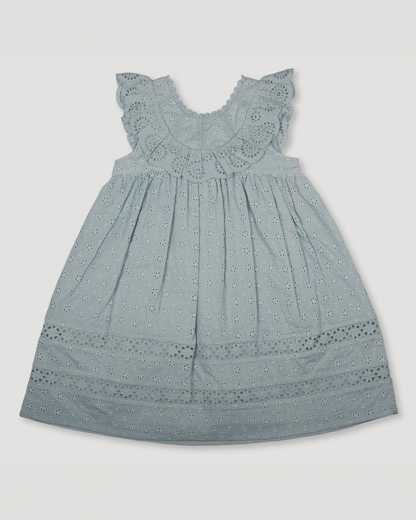 Early Sunday, Natasha Dress in Sea Dream color, made from All-Over Eyelet Embroidered Cotton Schifflie fabric, featuring flattering fit with delicate finishes, combining style and functionality for an effortlessly elegant look, shown in a front flat-lay view
