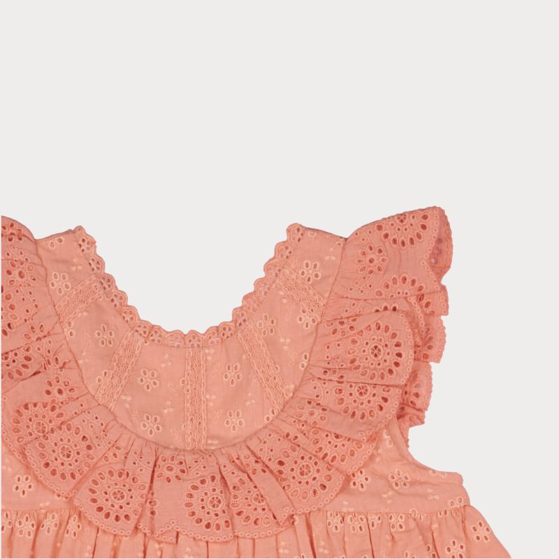 Early Sunday, Natasha Dress in Strawberry color, made from All-Over Eyelet Embroidered Cotton Schifflie fabric, featuring flattering fit with delicate finishes, combining style and functionality for an effortlessly elegant look, shown in a closeup flat-lay view
