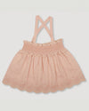 Early Sunday, Olivia Blouse in Pink Sand color, made from Canvas 70% Cotton 30% Linen fabric, featuring smocked bodice for a flexible fit, cross-back strap sand a flared hem, shown in a front flat lay view
