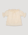Early Sunday, Ophelie Blouse in Hazelnut Cream, made from All-Over Embroidered Cotton Cambric fabric, featuring Comfort-first design with a playful silhouette and French seams, shown in a back flat-lay view