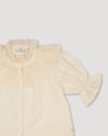 Early Sunday, Ophelie Blouse in Hazelnut Cream, made from All-Over Embroidered Cotton Cambric fabric, featuring Comfort-first design with a playful silhouette and French seams, shown in a closeup flat-lay view