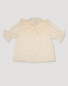 Early Sunday, Ophelie Blouse in Hazelnut Cream, made from All-Over Embroidered Cotton Cambric fabric, featuring Comfort-first design with a playful silhouette and French seams, shown in a front flat-lay view