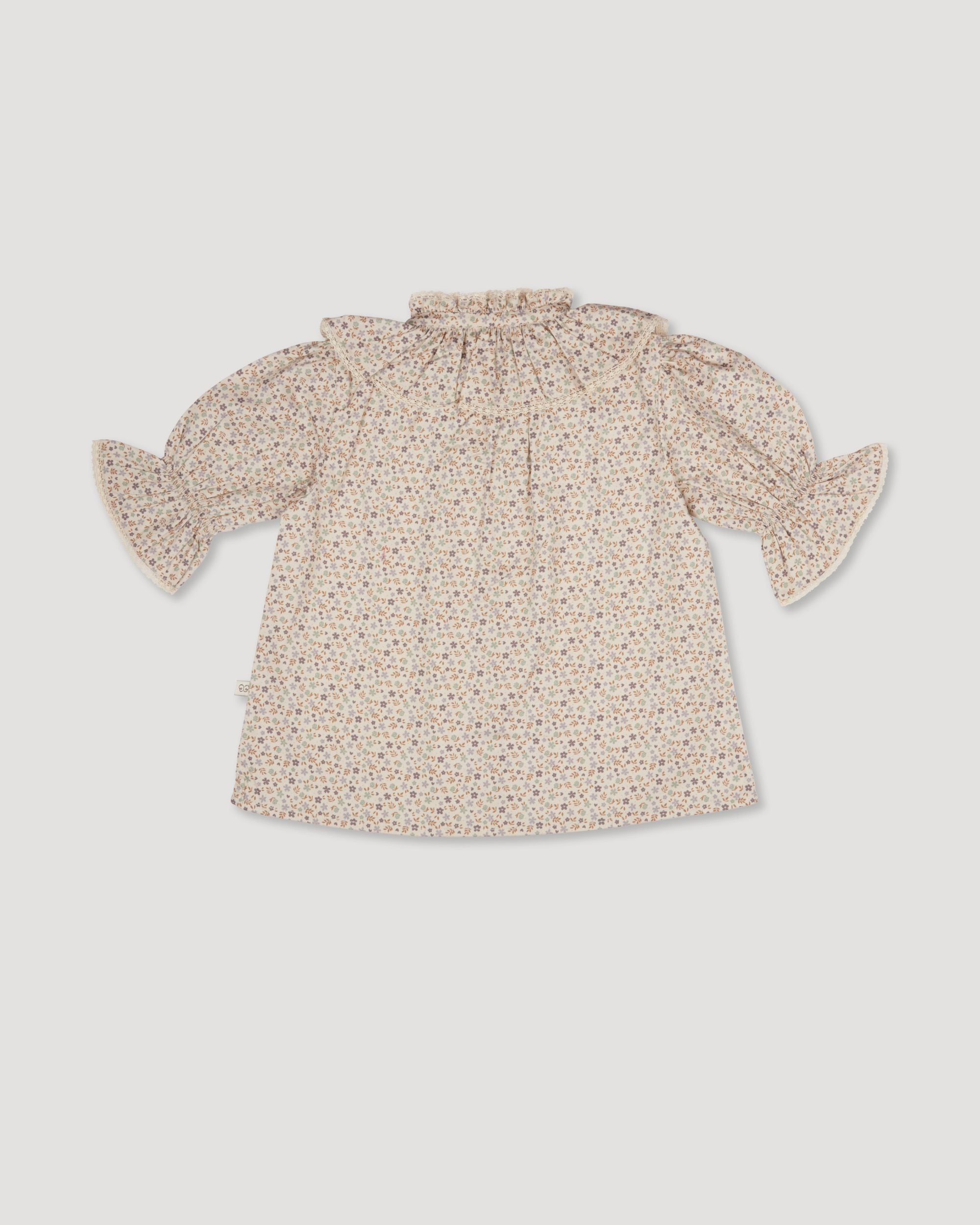Early Sunday, Ophelie Blouse in Miny Flowers print, made from Printed Cotton Satin fabric, featuring Comfort-first design with a playful silhouette and French seams, shown in a back flat-lay view