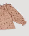 Early Sunday, Paloma Blouse in Acorn Dusty Pink, made from Printed Cotton Double Gauze fabric, featuring relaxed fit with a ruffle neckline, shown in a closeup flat-lay view