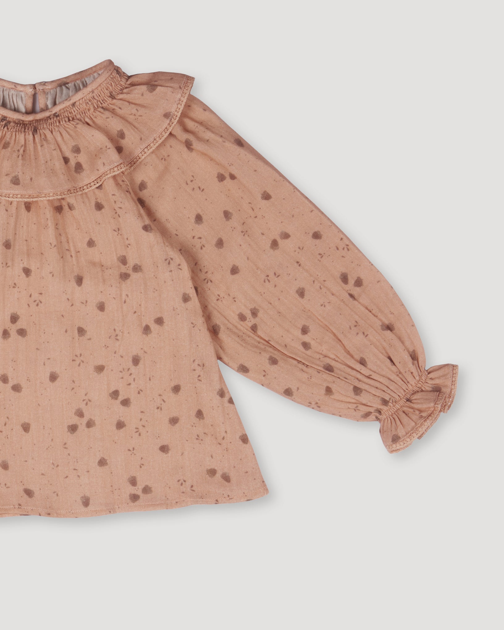 Early Sunday, Paloma Blouse in Acorn Dusty Pink, made from Printed Cotton Double Gauze fabric, featuring relaxed fit with a ruffle neckline, shown in a closeup flat-lay view