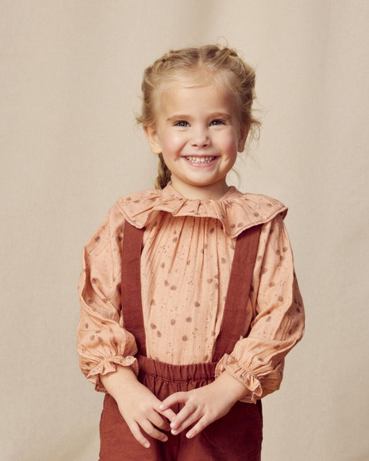 Early Sunday, Paloma Blouse in Acorn Dusty Pink, made from Printed Cotton Double Gauze fabric, featuring relaxed fit with a ruffle neckline, shown in a front view of model wearing it