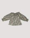 Early Sunday, Paloma Blouse in Autumn Bloom Soft Green, made from Printed Cotton Double Gauze fabric, featuring relaxed fit with a ruffle neckline, shown in a back flat-lay view