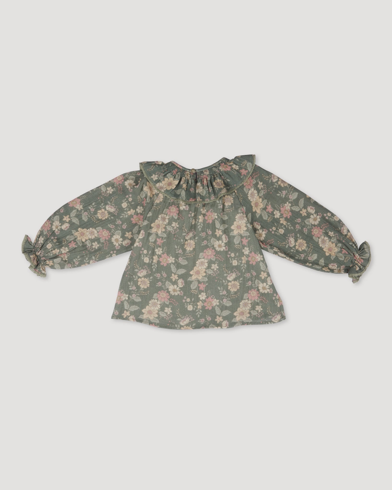 Early Sunday, Paloma Blouse in Autumn Bloom Soft Green, made from Printed Cotton Double Gauze fabric, featuring relaxed fit with a ruffle neckline, shown in a back flat-lay view