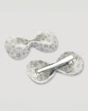 Early Sunday, Penelope Alligator Clip in Mini Flower print, made from Printed canvas 70% Cotton 30% Linen fabric, featuring a fabric bow design with a secure hair clip fastening, shown in a back flat-lay view