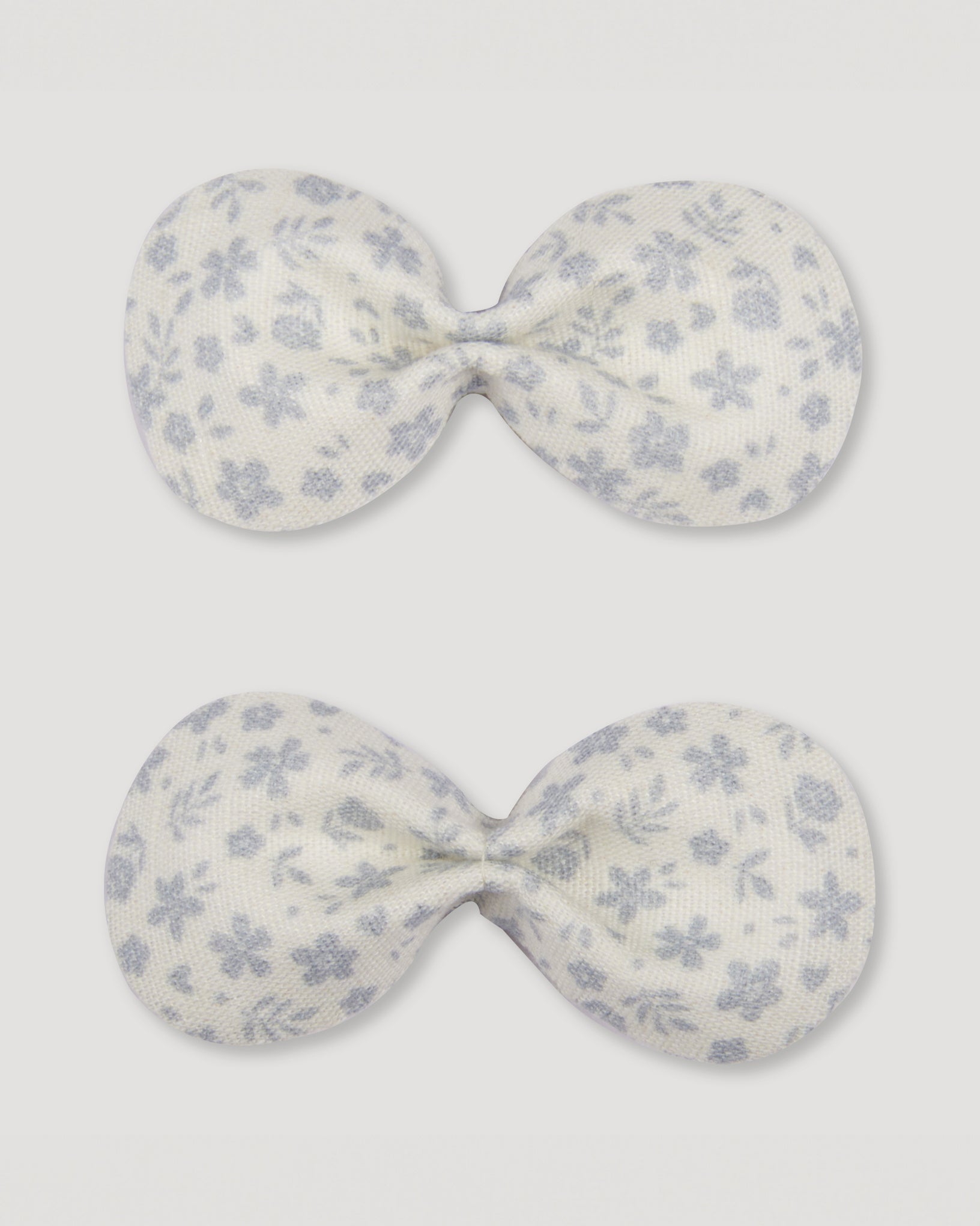 Early Sunday, Penelope Alligator Clip in Mini Flower print, made from Printed canvas 70% Cotton 30% Linen fabric, featuring a fabric bow design with a secure hair clip fastening, shown in a front flat-lay view