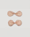 Early Sunday, Penelope Alligator Clip in Garden flower print, made from Printed Cotton Cambric fabric, featuring a bow design on an alligator clip with a secure fit, shown in a front flat-lay view