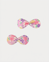 Early Sunday, Penelope Clip in Emma Floral Purple color, made from Organic Printed Cotton Cambric fabric, featuring a set of two bow clips with a secure fit, shown in front flat-lay view