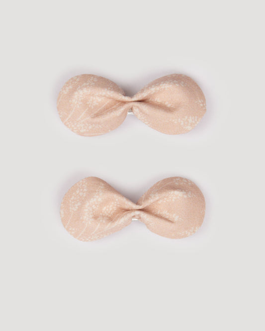 Early Sunday, Penelope Clip in Feather print, made from Printed 60s Cotton Cambric fabric, featuring a set of two bow clips with a secure fit, shown in a front flat-lay view