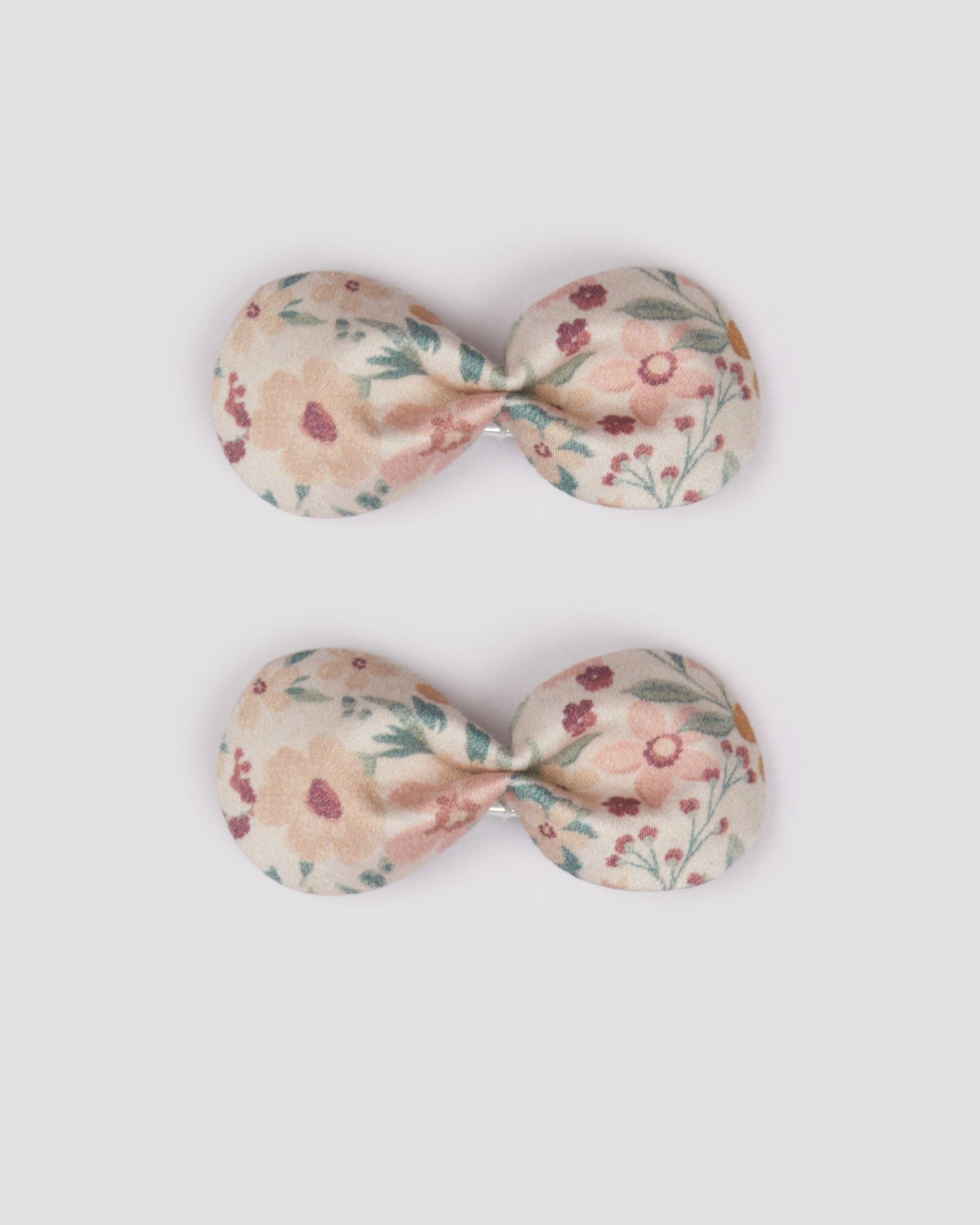 Early Sunday, Penelope Clip in Floral print, made from Printed 60s Cotton Satin fabric, featuring a set of two bow clips with a secure fit, shown in a front flat-lay view