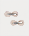 Early Sunday, Penelope Clip in Painted Bouquet print, made from Printed 70% Cotton, 30% Linen fabric, featuring a set of two bow clips with a secure fit, shown in a back flat-lay view