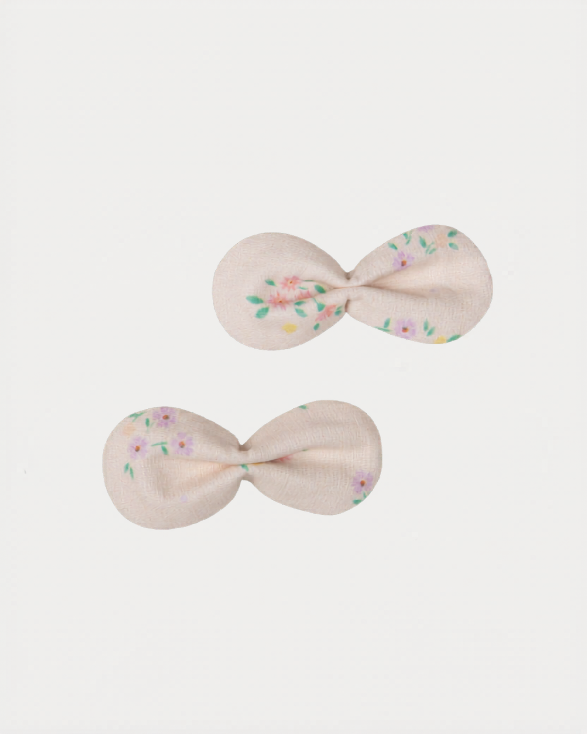 Early Sunday, Penelope Clip in Painted Bouquet print, made from Printed 70% Cotton, 30% Linen fabric, featuring a set of two bow clips with a secure fit, shown in a front flat-lay view