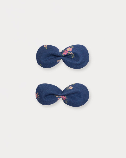 Early Sunday, Penelope Clip in Ditsy Bouquet Navy Blue, made from Printed Cotton Satin fabric, featuring a set of two bow clips with a secure fit, shown in a front flat-lay view