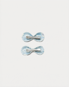 Early Sunday, Penelope Clip in Tonal Floral Blue color, made from Printed Cotton Tiny Swiss Dobby fabric, featuring a set of two bow clips with a secure fit, shown in back flat-lay view