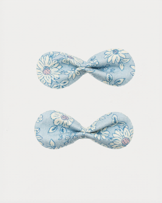 Early Sunday, Penelope Clip in Tonal Floral Blue color, made from Printed Cotton Tiny Swiss Dobby fabric, featuring a set of two bow clips with a secure fit, shown in closeup flat-lay view