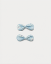 Early Sunday, Penelope Clip in Tonal Floral Blue color, made from Printed Cotton Tiny Swiss Dobby fabric, featuring a set of two bow clips with a secure fit, shown in front flat-lay view