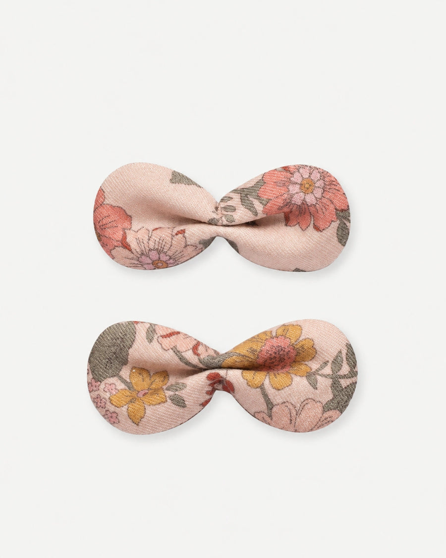 Early Sunday, Penelope Clip in Bloom Blush, made from Printed Viscose Twill fabric, featuring a set of two bow clips with a secure fit, shown in a front flat-lay view
